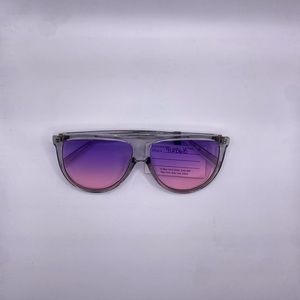 Woman’s large purple sunglasses